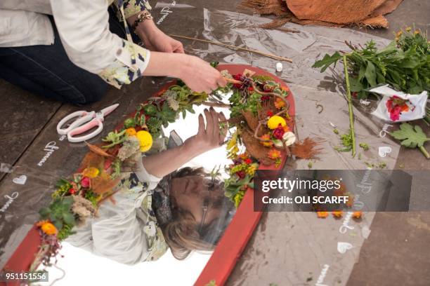 Woman creates a floral arrangement on the eve of the opening day of the Harrogate Spring Flower Show at the Great Yorkshire Showground in Harrogate,...