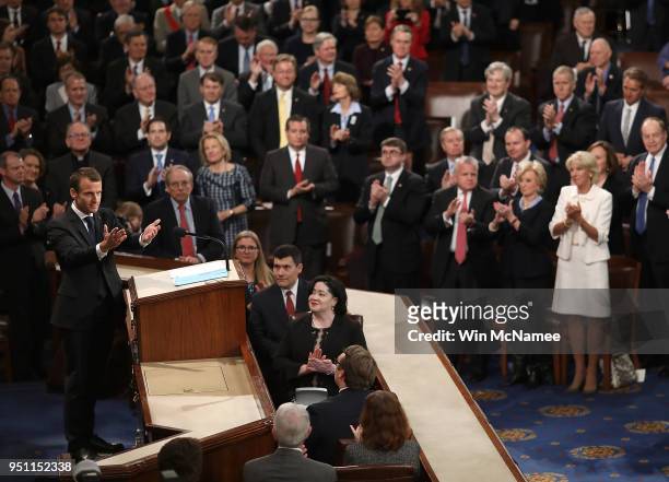 French President Emmanuel Macron reacts to a standing ovation after addressing a joint meeting of the U.S. Congress at the U.S. Capitol April 25,...