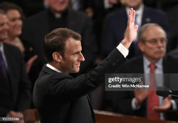 French President Emmanuel Macron reacts to a standing ovation after addressing a joint meeting of the U.S. Congress at the U.S. Capitol April 25,...