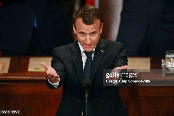 French President Emmanuel Macron acknowledges applause at the conclusion of his address to a joint meeting of the U.S. Congress in the House Chamber...