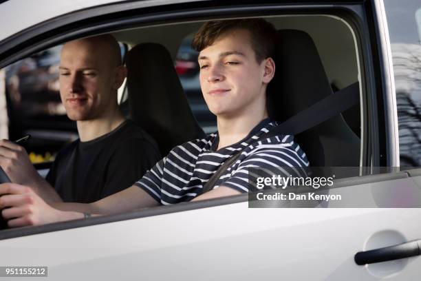 young driver with instructor - children in car stock pictures, royalty-free photos & images