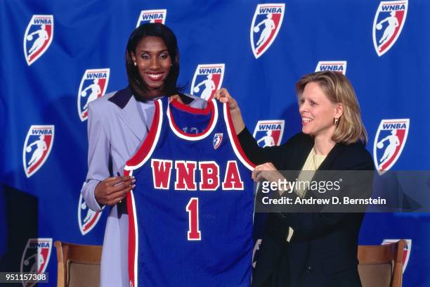 Lisa Leslie holds up a jersey after signing with the WNBA circa 1997 in Los Angeles, California. NOTE TO USER: User expressly acknowledges and agrees...