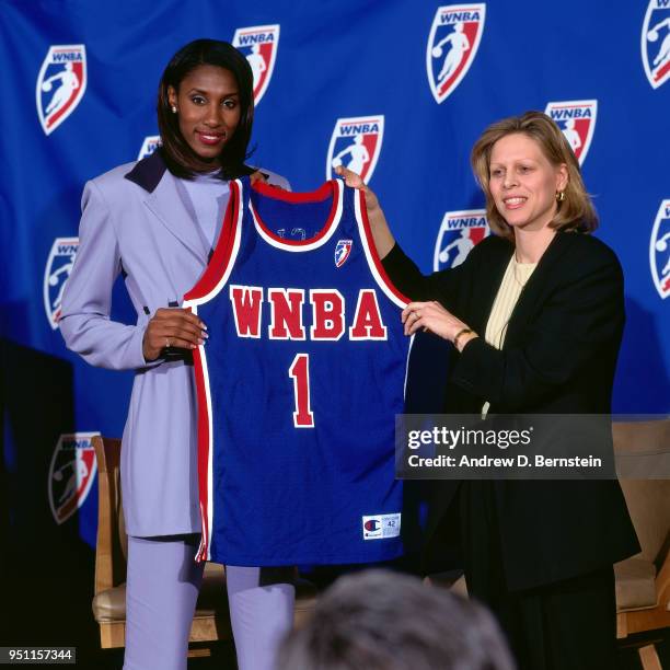 Lisa Leslie holds up a jersey after signing with the WNBA circa 1997 in Los Angeles, California. NOTE TO USER: User expressly acknowledges and agrees...