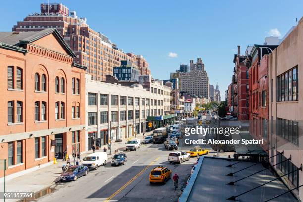 high angle view of a street with cars and traffic in chelsea district, new york city - chelsea new york fotografías e imágenes de stock