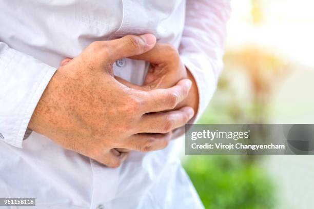 stomach pains - men stomach pain stock-fotos und bilder