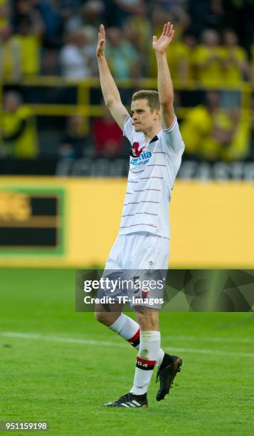 Sven Bender of Bayer Leverkusen applauds to the supporters of Dortmund after the Bundesliga match between Borussia Dortmund and Bayer 04 Leverkusen...