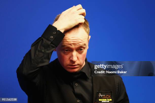 Chris Wakelin of England reacts during his first round match against Judd Trump of England during day five of the World Snooker Championship at...