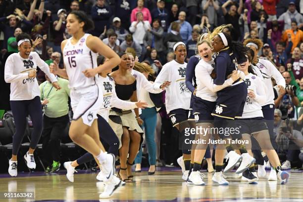 Arike Ogunbowale of the Notre Dame Fighting Irish celebrates with teammates during the semifinal game of the 2018 NCAA Photos via Getty Images...