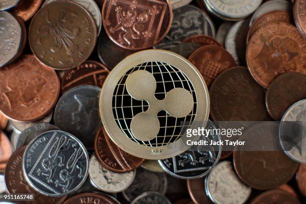 In this photo illustration of the ripple cryptocurrency 'altcoin' sits arranged for a photograph on April 25, 2018 in London, England. Cryptocurrency...