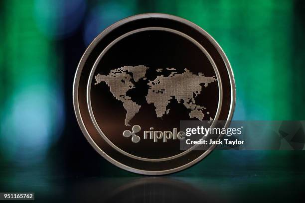 In this photo illustration of the ripple cryptocurrency 'altcoin' sits arranged for a photograph on April 25, 2018 in London, England. Cryptocurrency...