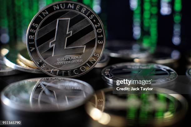 In this photo illustration of the litecoin cryptocurrency 'altcoin' sits arranged for a photograph on April 25, 2018 in London, England....