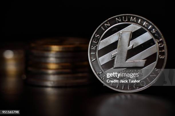 In this photo illustration of the litecoin cryptocurrency 'altcoin' sits arranged for a photograph on April 25, 2018 in London, England....