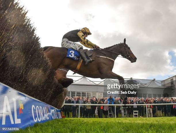 Naas , Ireland - 25 April 2018; Bellshill, with David Mullins up, jumps the last on their way to winning the Coral Punchestown Gold Cup at...