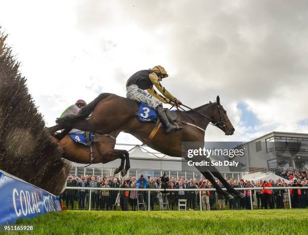 Naas , Ireland - 25 April 2018; Bellshill, with David Mullins up, jumps the last on their way to winning the Coral Punchestown Gold Cup at...