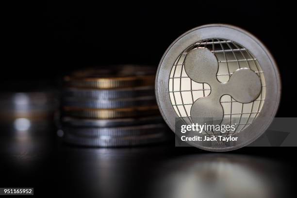 In this photo illustration of the ripple cryptocurrency 'altcoin' sits arranged for a photograph on April 25, 2018 in London, England. Cryptocurrency...