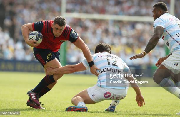 Ian Keatley of Munster is tackled by Henry Chavancy during the European Rugby Champions Cup Semi-Final match between Racing 92 and Munster Rugby at...