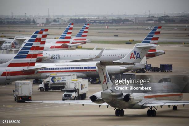 American Airlines Group Inc. Planes stand at Dallas-Fort Worth International Airport in Grapevine, Texas, U.S., on Friday, April 6, 2018. American...