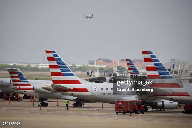 American Airlines Group Inc. Planes stand at Dallas-Fort Worth International Airport in Grapevine, Texas, U.S., on Friday, April 6, 2018. American...