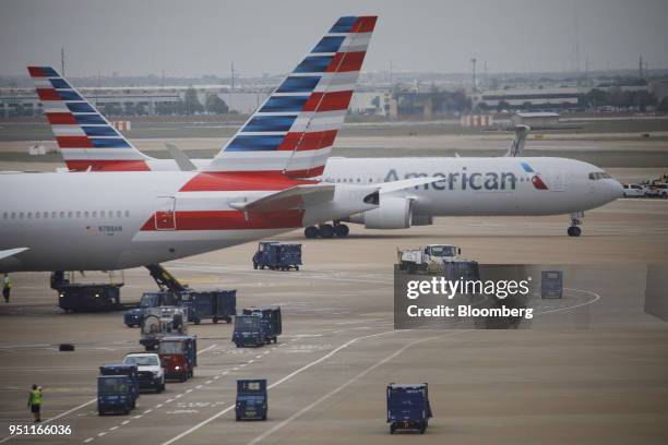 American Airlines Group Inc. Planes stand at Dallas-Fort Worth International Airport in Grapevine, Texas, U.S., on Friday, April 6, 2018. American...