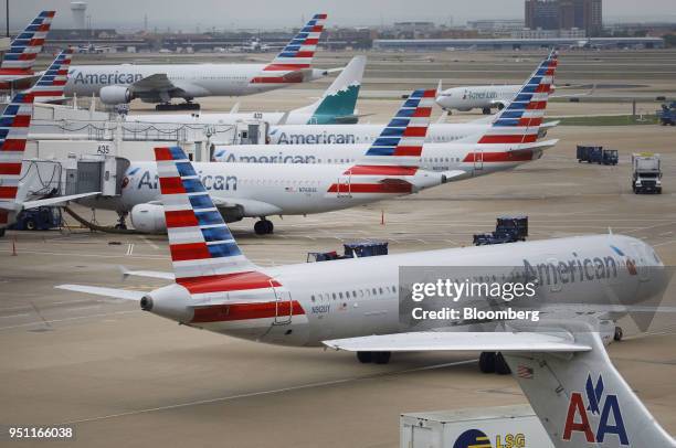 American Airlines Group Inc. Planes stand at Dallas-Fort Worth International Airport in Grapevine, Texas, U.S., on Friday, April 6, 2018. American...