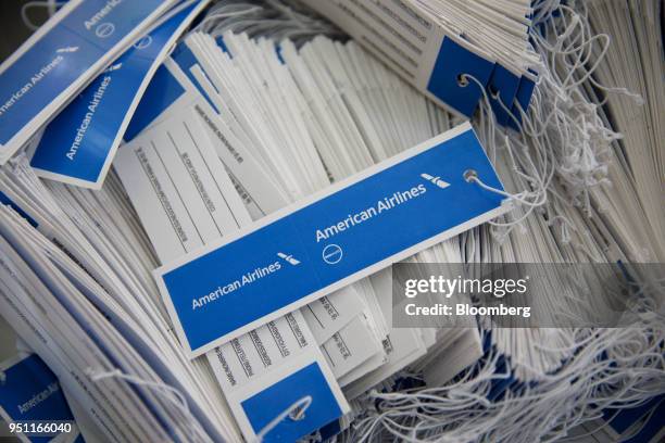 American Airlines Group Inc. Luggage tags are arranged for a photograph at Dallas-Fort Worth International Airport in Grapevine, Texas, U.S., on...