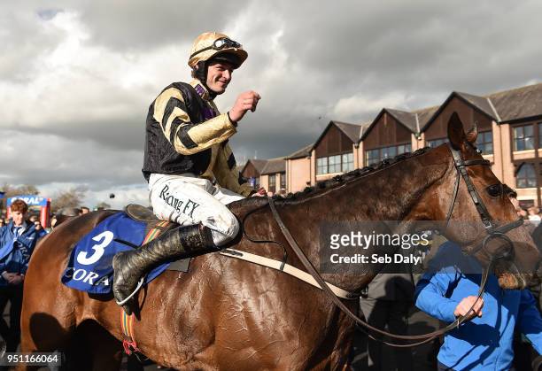 Naas , Ireland - 25 April 2018; Jockey David Mullins enters the winners' enclosure after winning the Coral Punchestown Gold Cup on Bellshill at...