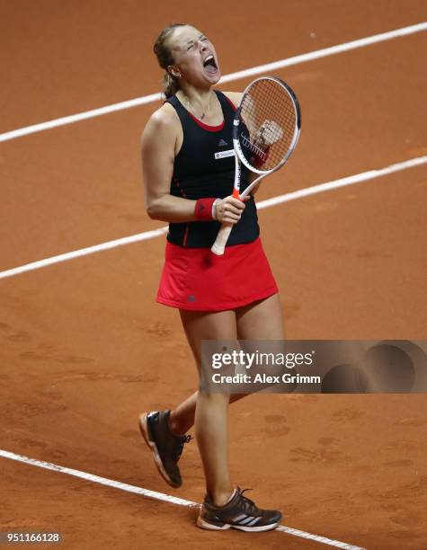 Anett Kontaveit of Estonia celebrates after defeating Kristina Mladenovic of France during day 3 of the Porsche Tennis Grand Prix at Porsche-Arena on...