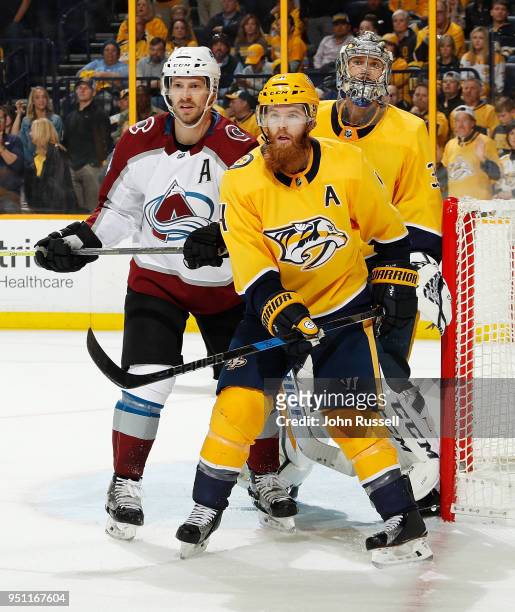 Blake Comeau of the Colorado Avalanche battles in the crease against Ryan Ellis and Pekka Rinne of the Nashville Predators in Game Five of the...