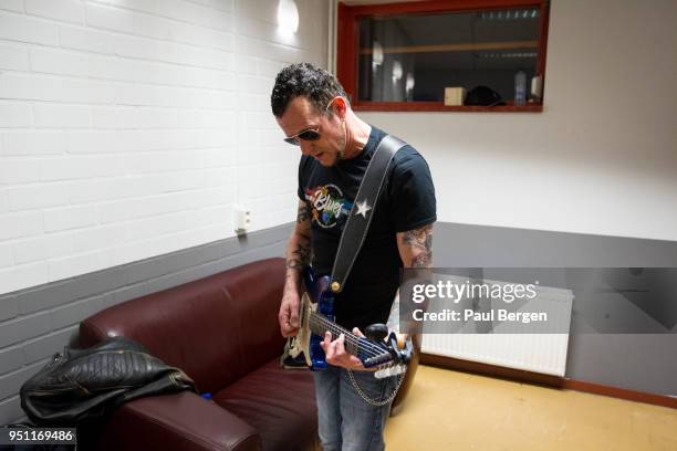 American blues guitarist Gary Hoey warms up backstage in his dressing room at The Boerderij, Zoetermeer, Netherlands, 16th March 2018.