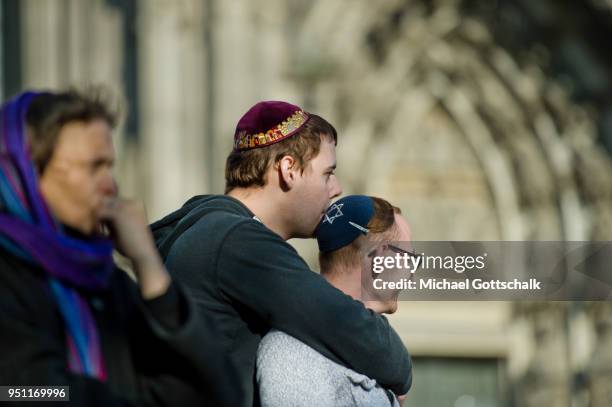 Activists attend a "wear a kippah" gathering to protest against anti-Semitism in front of Cologne Cathedral or Koelner Dom on April 25, 2018 in...