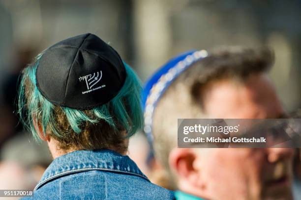 Activists attend a "wear a kippah" gathering to protest against anti-Semitism in front of Cologne Cathedral or Koelner Dom on April 25, 2018 in...