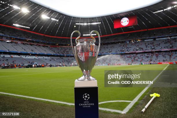The UEFA Champions League trophy is on display prior to the semi-final first-leg football match FC Bayern Munich v Real Madrid CF in Munich, southern...