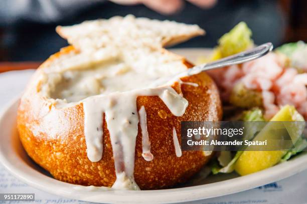 clam chowder served in a bread bowl - chowder bildbanksfoton och bilder