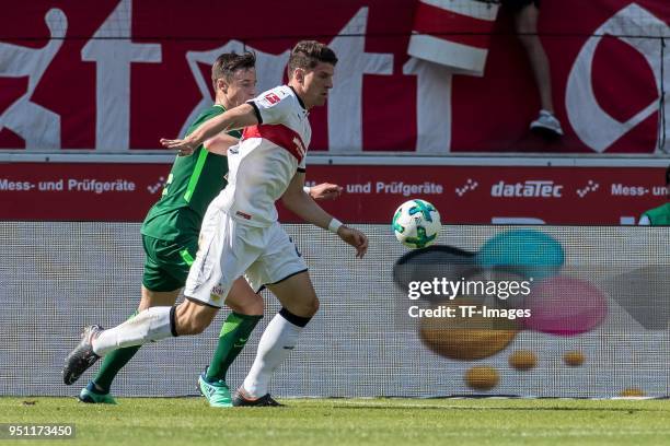 Marco Friedl of Bremen and Mario Gomez Garcia of Stuttgart battle for the ball during the Bundesliga match between VfB Stuttgart and SV Werder Bremen...