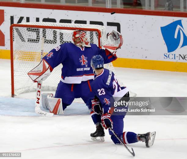 Goalie Ben Bowns of Great Britain watches the puck next to Paul Swindlehurst of Great Britain during the 2018 IIHF Ice Hockey World Championship...