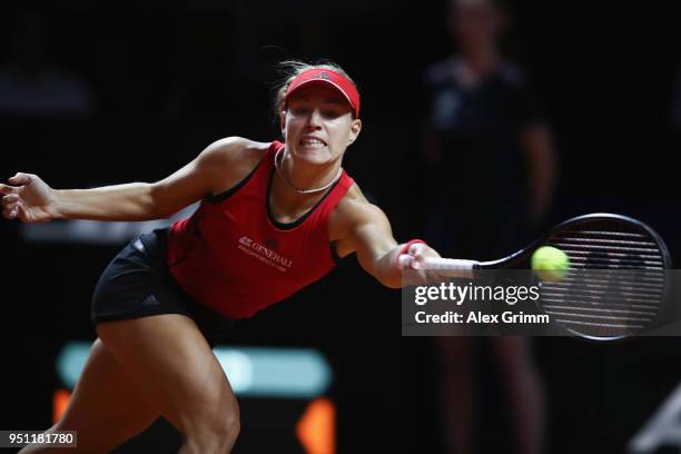 Angelique Kerber of Germany plays a forehand to Petra Kvitova of Czech Republic during day 3 of the Porsche Tennis Grand Prix at Porsche-Arena on...