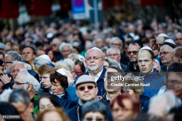 Participants wearing a kippah during a "wear a kippah" gathering to protest against anti-Semitism in front of the Jewish Community House on April 25,...