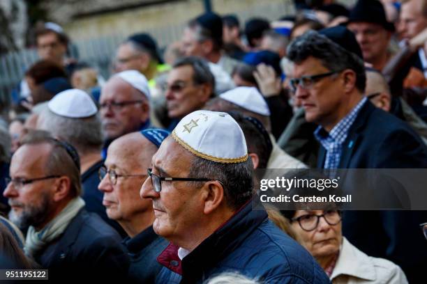 Participants wearing a kippah during a "wear a kippah" gathering to protest against anti-Semitism in front of the Jewish Community House on April 25,...