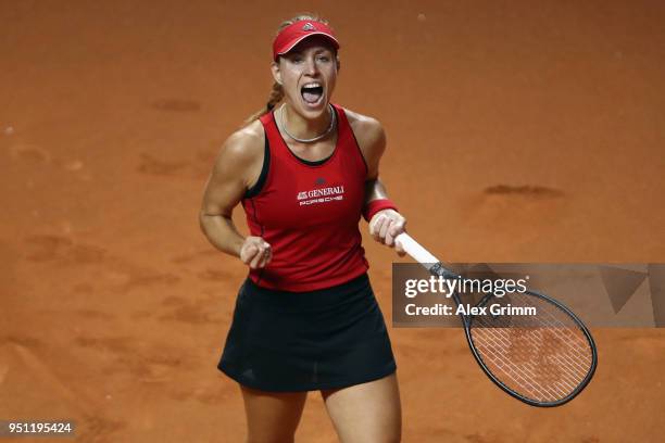 Angelique Kerber of Germany celebrates during her match against Petra Kvitova of Czech Republic during day 3 of the Porsche Tennis Grand Prix at...