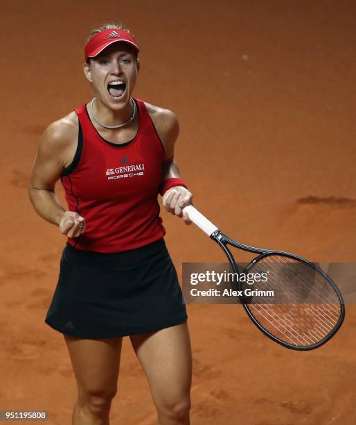 Angelique Kerber of Germany celebrates during her match against Petra Kvitova of Czech Republic during day 3 of the Porsche Tennis Grand Prix at...