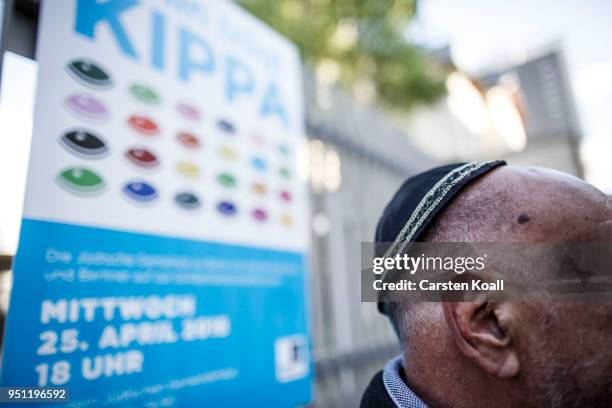 Participant wears a kippah during a "wear a kippah" gathering to protest against anti-Semitism in front of the Jewish Community House on April 25,...