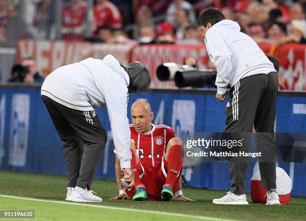 Arjen Robben of Bayern Muenchen goes down following in an injury during the UEFA Champions League Semi Final First Leg match between Bayern Muenchen...