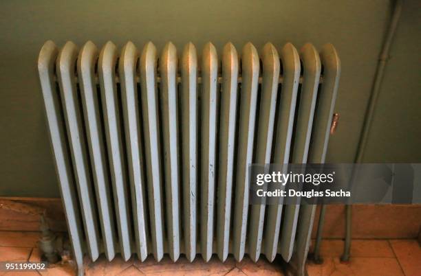 old style cast iron household steam radiator for heat - pollution officer stock pictures, royalty-free photos & images