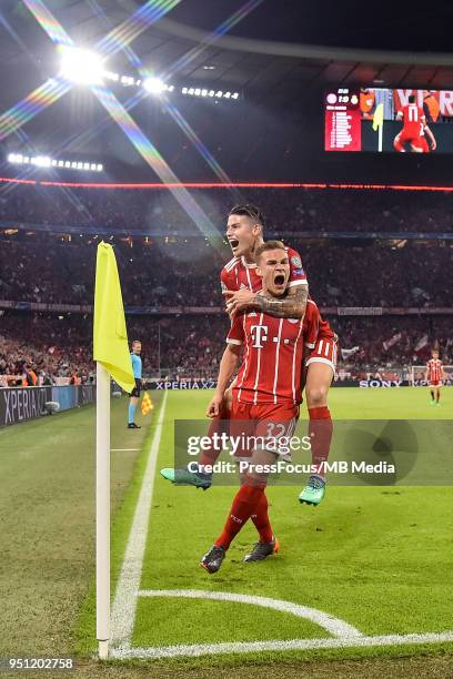 Joshua Kimmich of Bayern Muenchen celebrates with team-mate James Rodriguez after scoring the opening goal during the UEFA Champions League Semi...