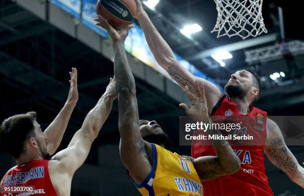 Thomas Robinson, #0 of Khimki Moscow Region competes with Nikita Kurbanov, #41 and Leo Westemann, #9 of CSKA Moscow of CSKA Moscow in action during...