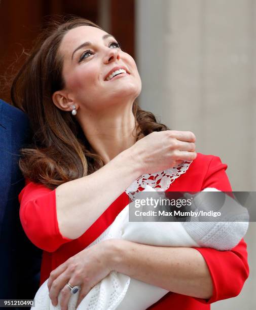 Prince William, Duke of Cambridge and Catherine, Duchess of Cambridge depart the Lindo Wing of St Mary's Hospital with their newborn baby son on...