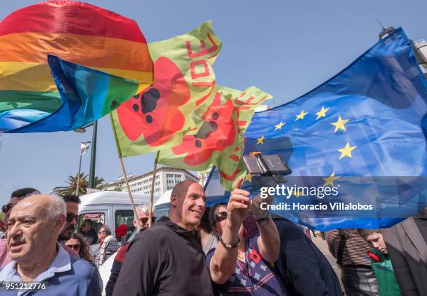 Former Greek Finance Minister and co-founder of DiEM25 Yanis Varoufakis poses for selfies with supporters before walking through Avenida da Liberdade...