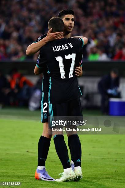 Marco Asensio of Real Madrid celebrates with teammate Lucas Vazquez after scoring his sides second goal during the UEFA Champions League Semi Final...