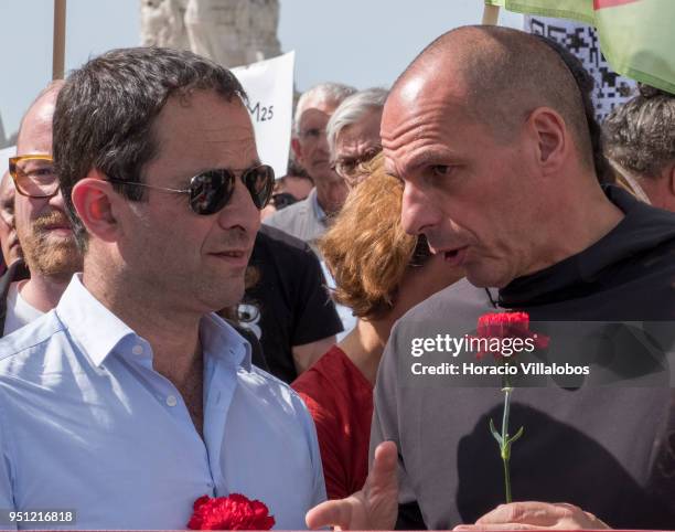 Former Greek Finance Minister Yanis Varoufakis and former French Socialist Party member and founder of Génération-s Benoit Hamon chat before walking...