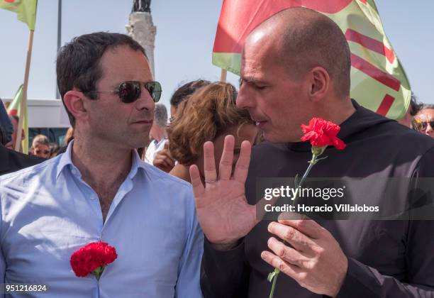 Former Greek Finance Minister Yanis Varoufakis and former French Socialist Party member and founder of Génération-s Benoit Hamon chat before walking...